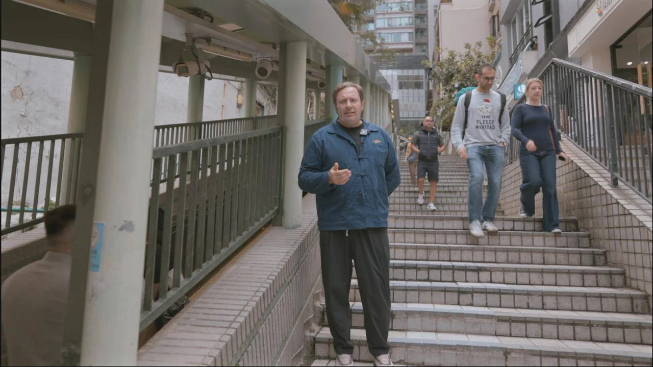 Sergei Minaev filming beside Hong Kong's Central–Mid-Levels escalators